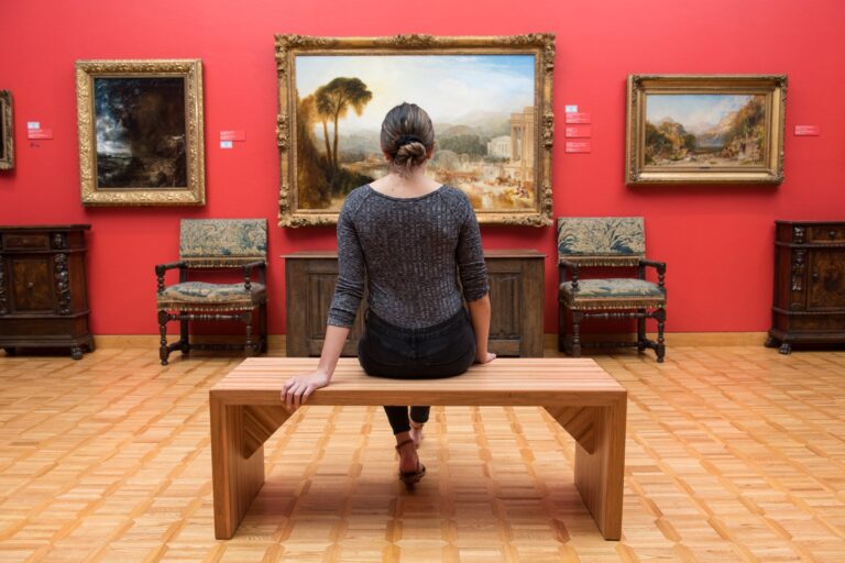 Woman looking at artwork in Beaverbrook Art Gallery